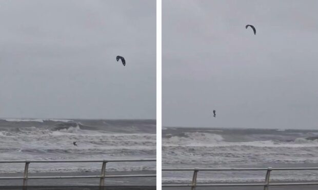 Kite surfer defies Storm Babet warnings to ride waves at Kirkcaldy.