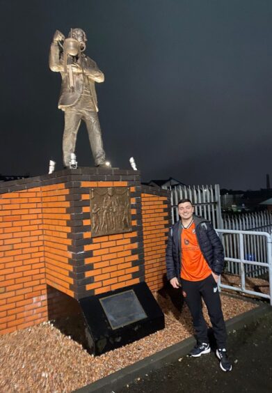 Agustin Mervic poses with the statue of iconic ex-Dundee United manager Jim McLean.