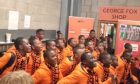 The Singing Children of Africa entertain Dundee United fans in the George Fox Stand at Tannadice