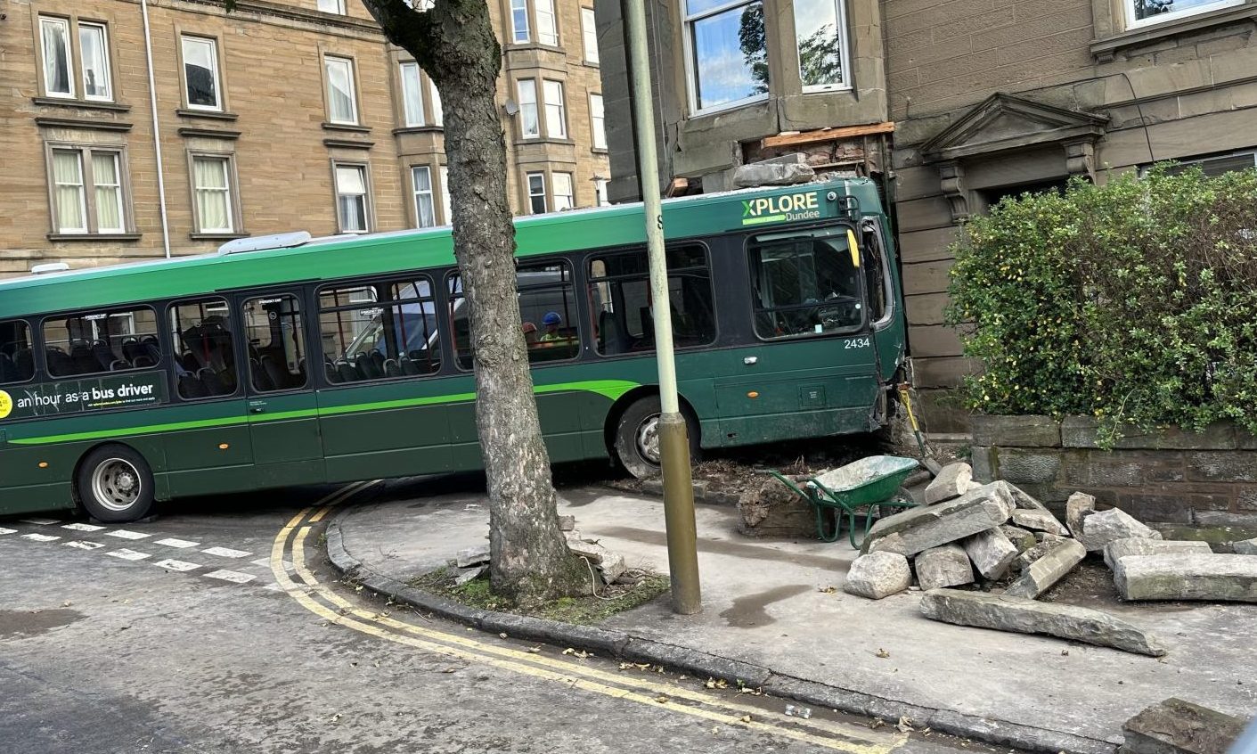 Xplore Dundee bus remains stuck in building three days after crash