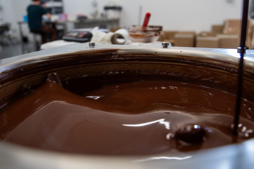 A vat of tempered chocolate.