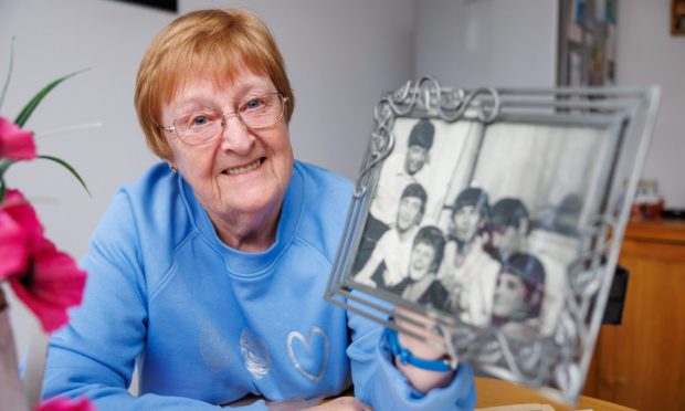 Rita Page with the photo of her and the Beatles when they came to Kirkcaldy.
