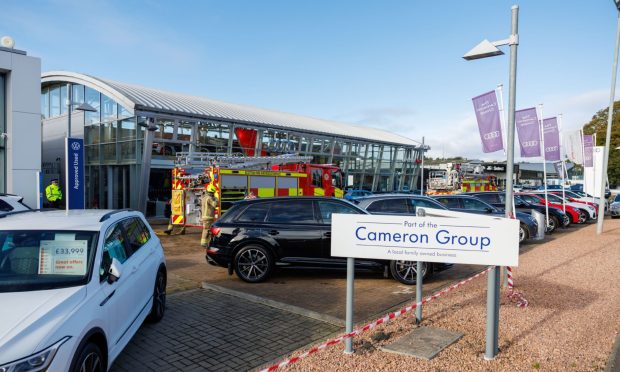 Fire crews tackled the blaze at Cameron Motor Group in Perth in October.