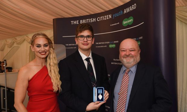 Alexander at the London award ceremony with BCYA patron Kimberly Wyatt and James Cathcart, founder director of Youth Voice Heard. Image: Supplied