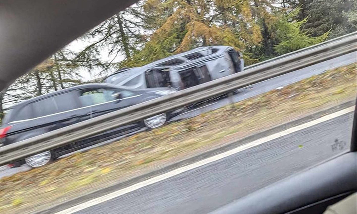 A car flipped over on the M90