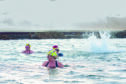 Julie Brooks, front, swims all year round with the Menopausal Mermaids in Pittenweem. Image: Anna Deacon.