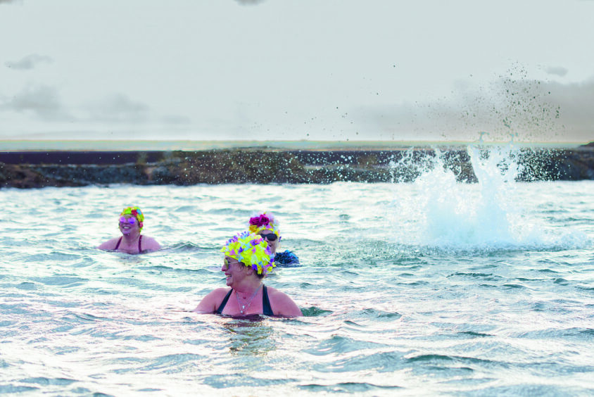 Julie Brooks, front, swims all year round with the Menopausal Mermaids in Pittenweem. Image: Anna Deacon.