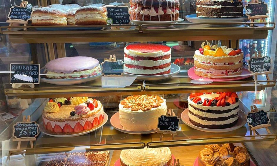 The cake cabinet at Merchants House Cafe.