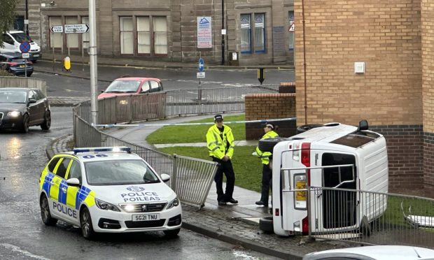 Van on its side at Ladywell roundabout in Dundee city centre.