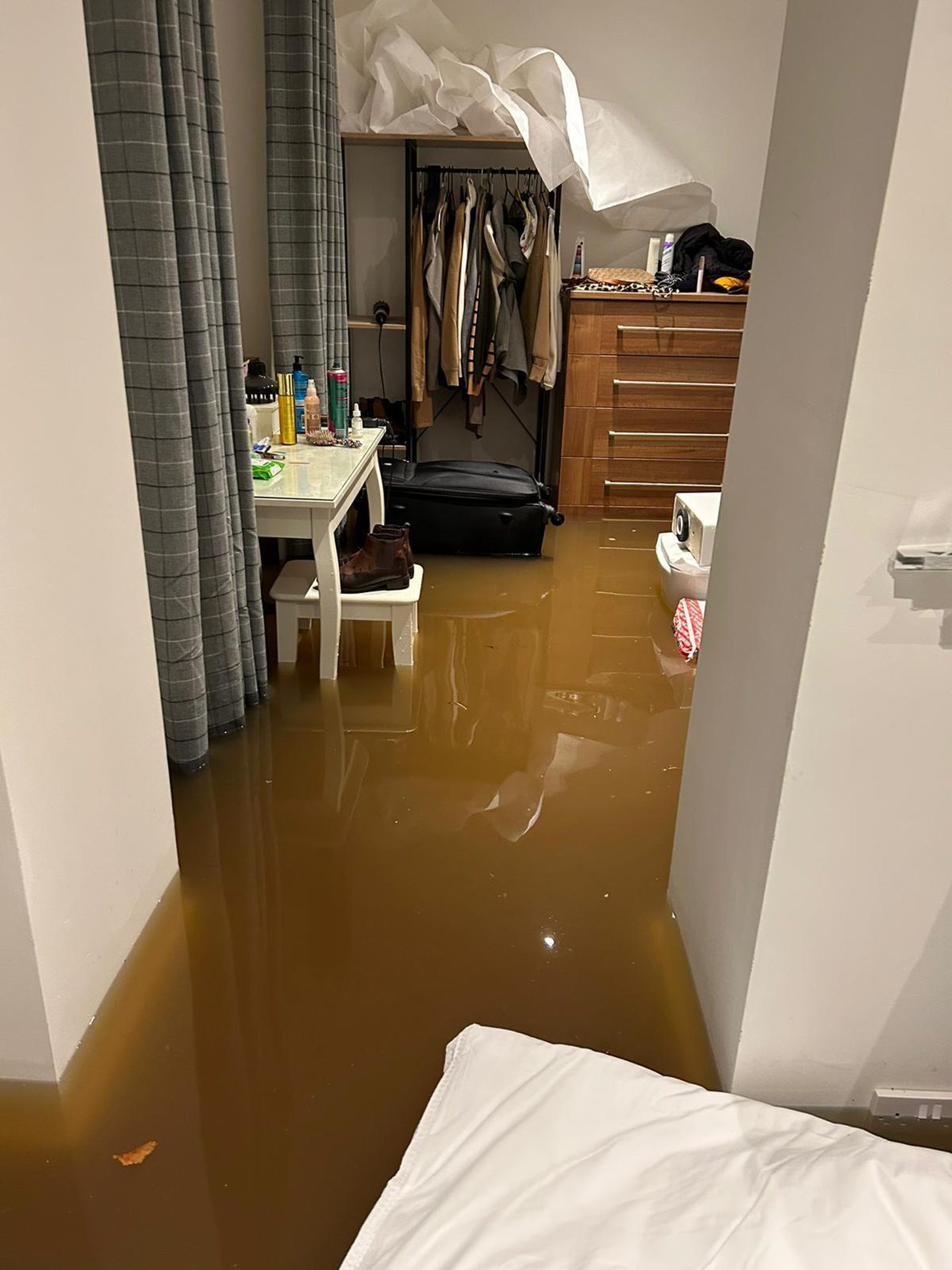 Destroyed furniture at Perth Airbnb with flooding 