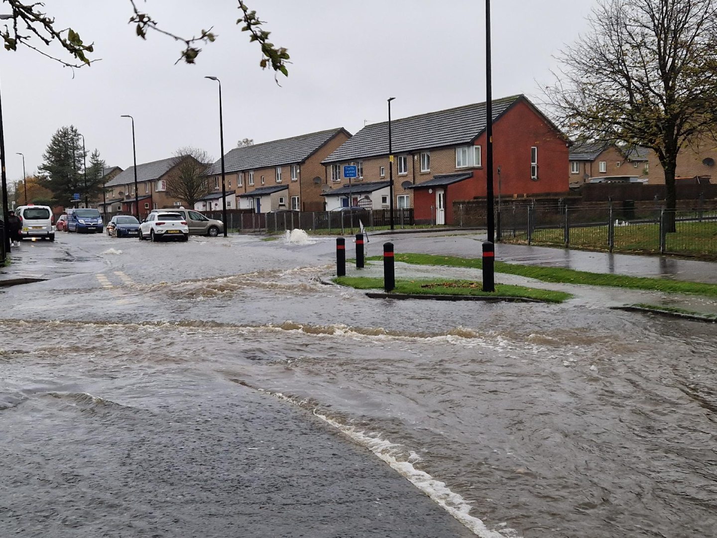 Flooding with overflowing gutter in the Ardler area of Dundee during Storm Babet.