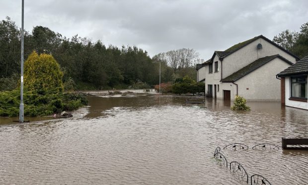 Flooding on Milton Place, Monifieth, during Storm Babet. Image: Poppy Watson/DC Thomson