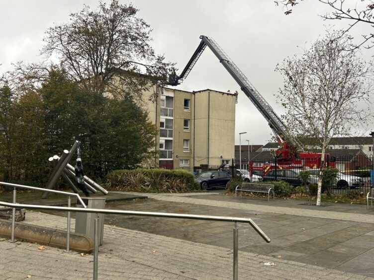 Emergency services remain at the Francis Street flats after the fire. 