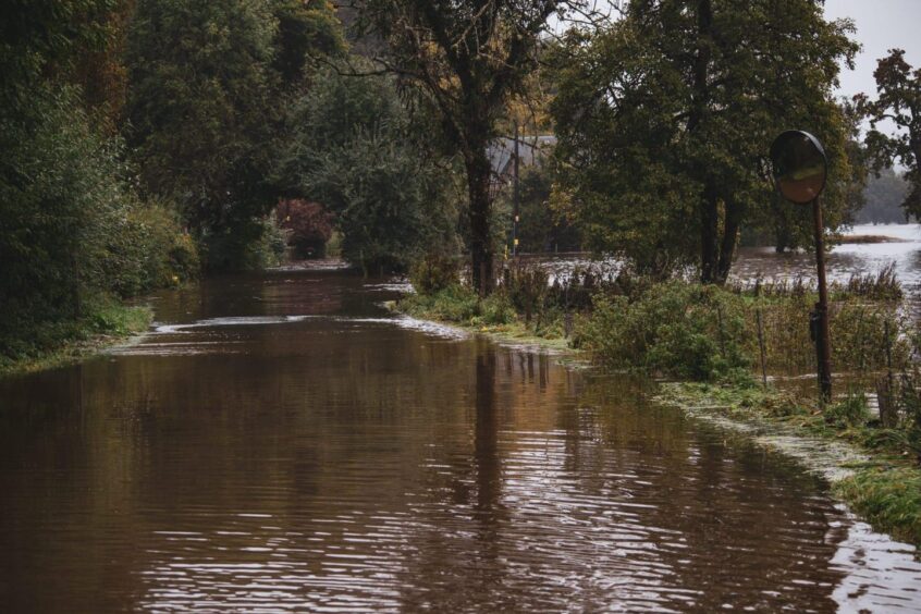 The road through the village was submerged during the floods in Perthshire 