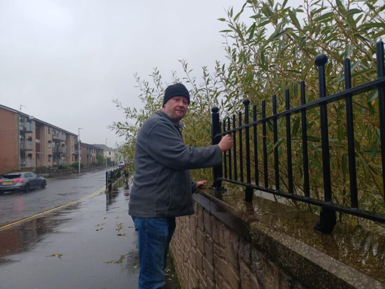 Michael Vettesse assesses the potential for flooding in River Street, Brechin