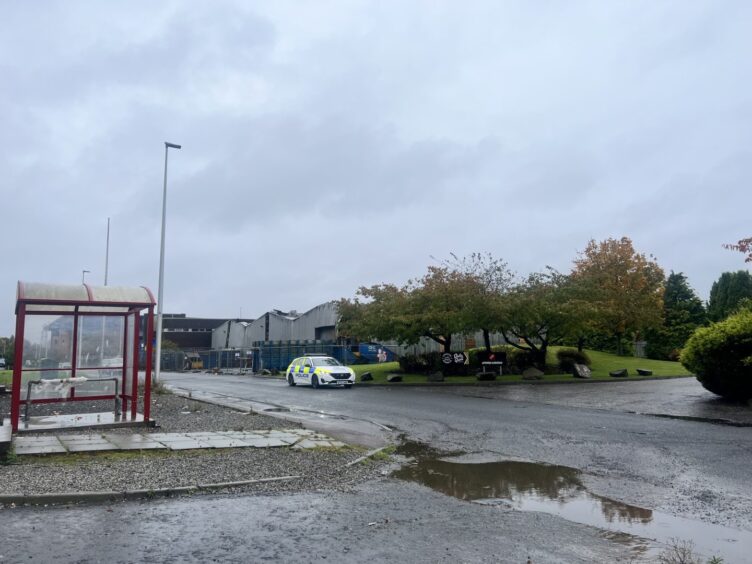 Police have blocked access to the old JWT building at Dundee industrial estate.