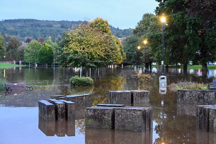 Flooding on North Inch Park showing bins and trees underwater