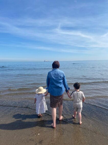 Rosemarie Broadley, who is blind, with her two grandchildren, Blythe and Zachary.