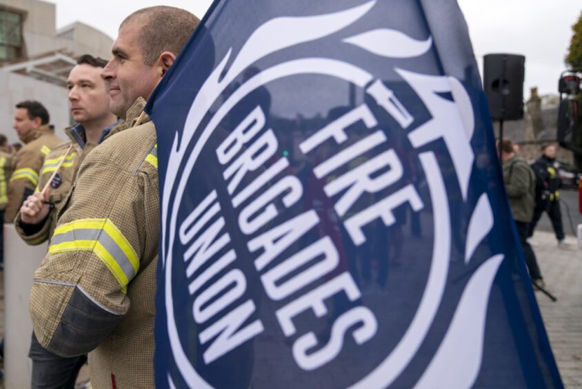 Firefighters outside the Scottish Parliament in Edinburgh