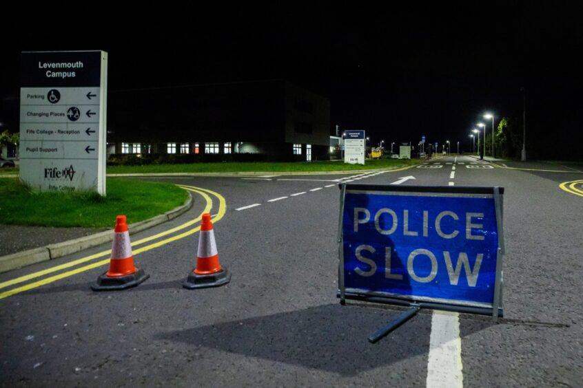 Signs warning of a road closure during the Levenmouth Academy fire