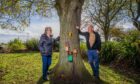Pam Paton and Alec Edwards beside one of the trees on the fair door trail. Image: Steve MacDougall/DC Thomson