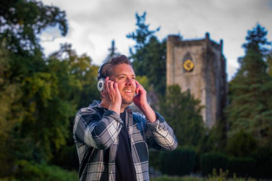 CR0045034 - Rebecca Baird Story - Perthshire area - Murmurations, a new outdoor theatre project using headphones.  Picture shows director Nathan Curry with Dunkeld Cathedral in the background  - close to Fiddler's Path and The Cross, Dunkeld - Friday 29th September 2023
Image: Steve MacDougall/DC Thomson