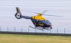 A police helicopter has been involved in the search. Image: Steve MacDougall/DC Thomson