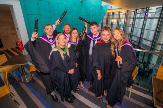 Left to right is Cai Macdonald, Kelli Cochrane-Sharp, Daniel Ferguson, Bethany Calderwood, Charlie Page, Jen Austin (lecturer) and Arrianna Loughran, all graduating in Bsc Sports and Fitness.
Image: Steve MacDougall/DC Thomson