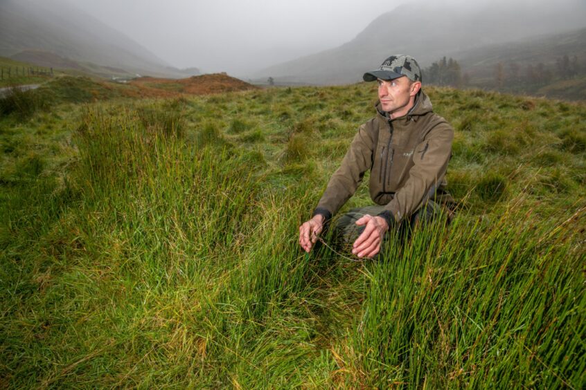 Head gamekeeper Richard on the Perthshire estate with a humane cable snare. Image: Steve Brown/DC Thomson.