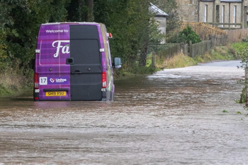 Van stranded in floodwater at Kemback.