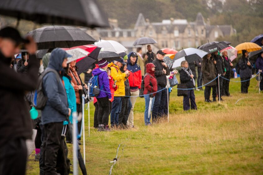 Dunhill Cup celebrities The rain didn't deter these spectators. 
