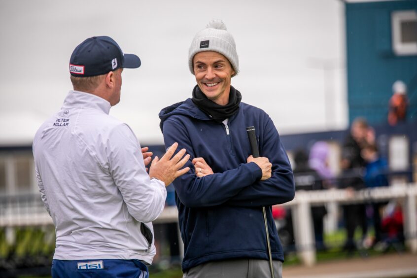 Dunhill Cup celebrities The King's Man and Imitation Game star Matthew Goode enjoying a chat in St Andrews.