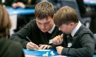 Two boys puzzling over a sum in Fife schools maths challenge