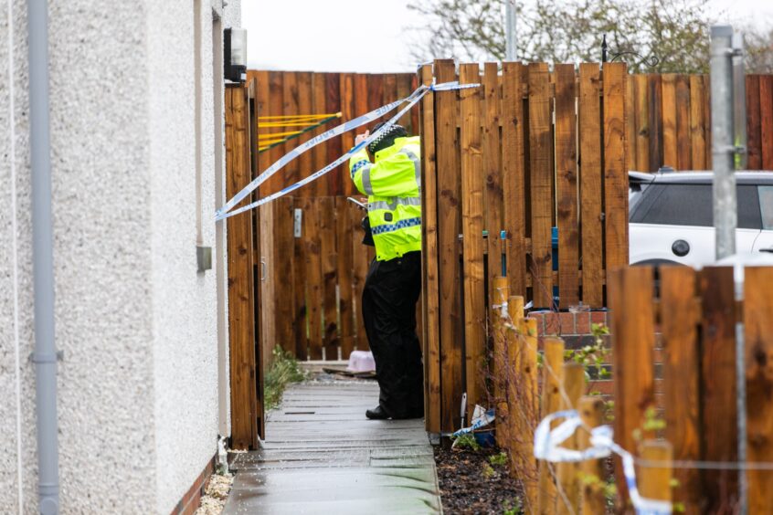 Police outside the taped off property in Fife.