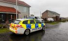 Police remained outside the property in Guardbridge, Fife, on Friday.