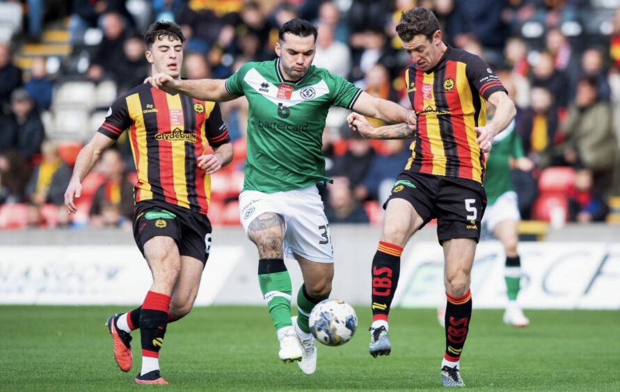 Dundee United's Tony Watt, centre, in action at Partick Thistle