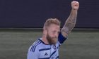 Johnny Russell celebrates his opener for Sporting KC