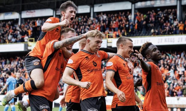 Dundee United players celebrate a late leveller against Dunfermline.