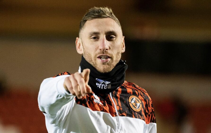 Dundee United's Louis Moult warming up at Airdrie 
