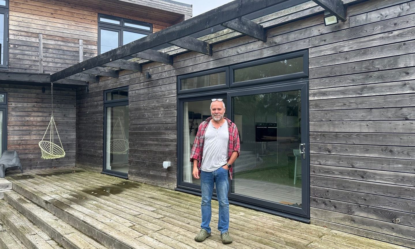Timber clad house near Milnathort with living roof built by owner