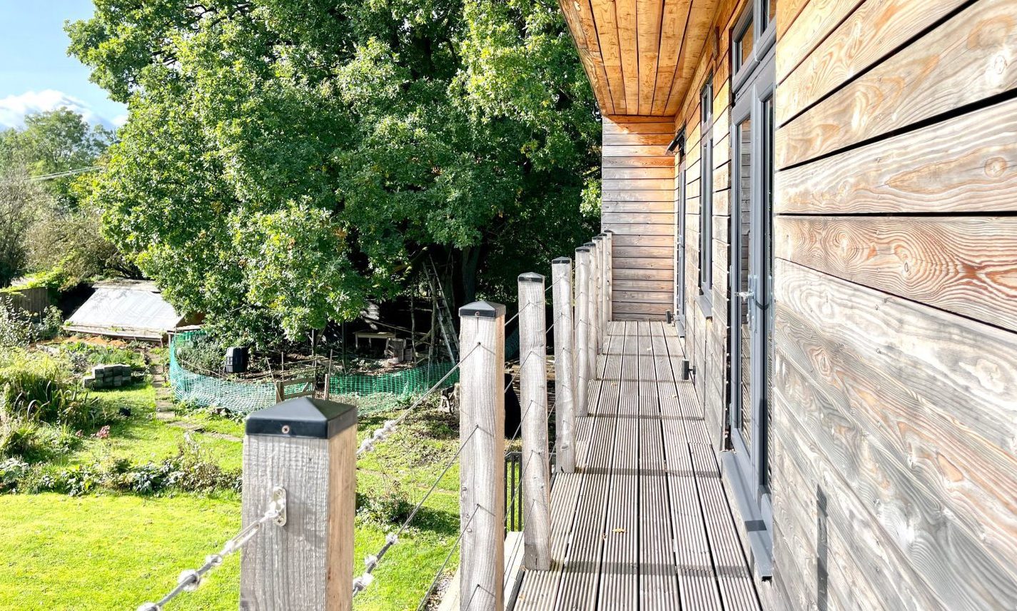 Timber clad house near Milnathort with living roof built by owner