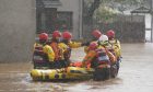 Members of the emergency services help local residents to safety in Brechin, Scotland, as Storm Babet batters the country. Flood warnings are in place in Scotland, as well as parts of northern England and the Midlands. Thousands were left without power and facing flooding from "unprecedented" amounts of rain in east Scotland, while Babet is set to spread into northern and eastern England on Friday. Picture date: Friday October 20, 2023. PA Photo. See PA story WEATHER Babet. Photo credit should read: Andrew Milligan/PA Wire