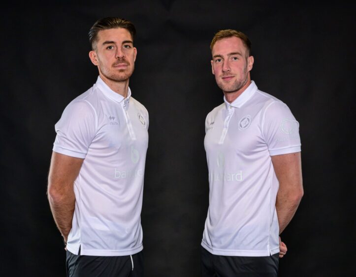 Dundee United will wear a special one-off kit on Friday, as modelled by Declan Gallagher, left, and Kevin Holt.