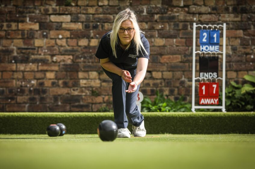 Alison playing bowls. 