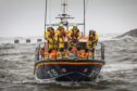 RNLB Inchcape takes to the water for the wreath-laying ceremony. Image: Mhairi Edwards/DC Thomson