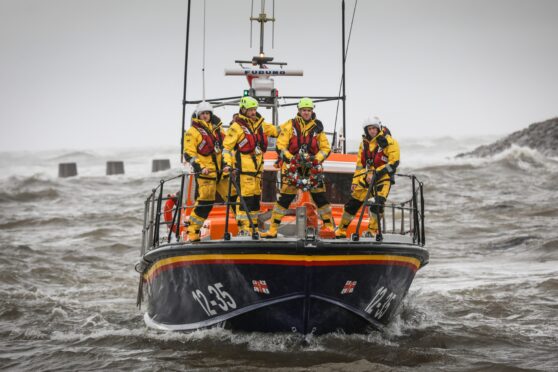 RNLB Inchcape takes to the water for the wreath-laying ceremony. Image: Mhairi Edwards/DC Thomson