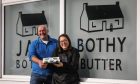 Hamish and Kim holding a plate of Bothy Butter outside the Bothy Larder
