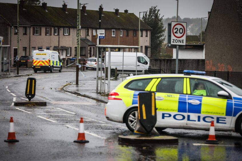 Police at the scene of the Dundee shop fire 