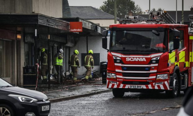 Woman still in hospital after fire at Dundee store