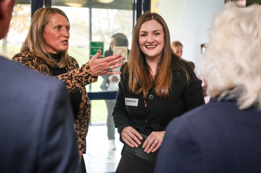 Ms Don being shown round the Fife Bairns' Hoose. 